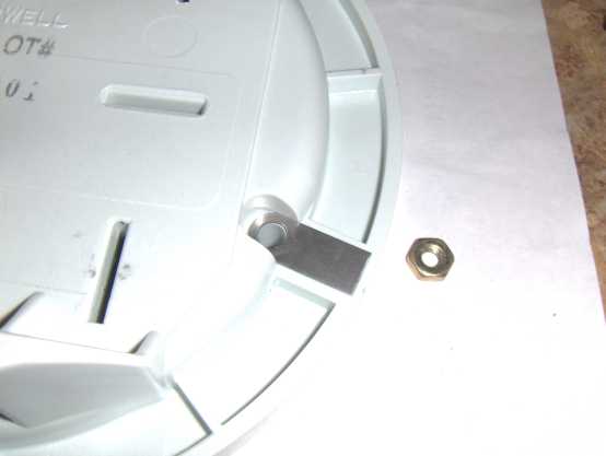 bottom part of enclosure showing nut and contact strip.