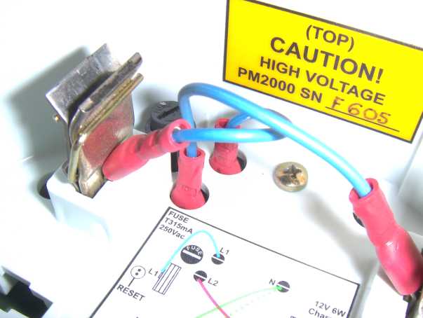 Top view of PM2000 showing wires to be unplugged