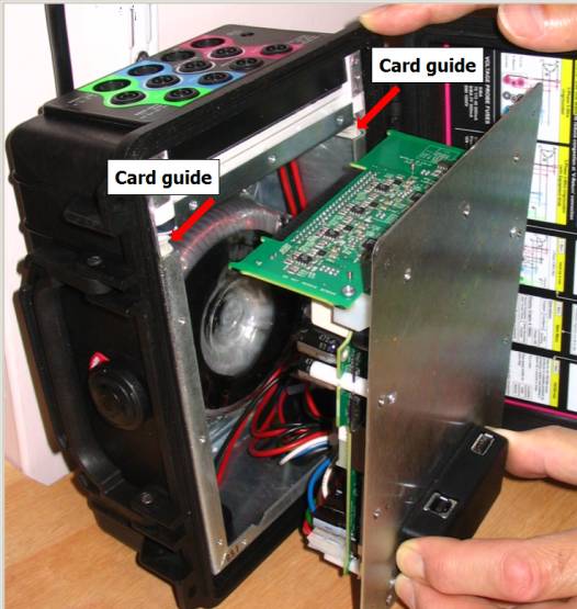 offer up the electronics assembly to the card guides in the chassis
